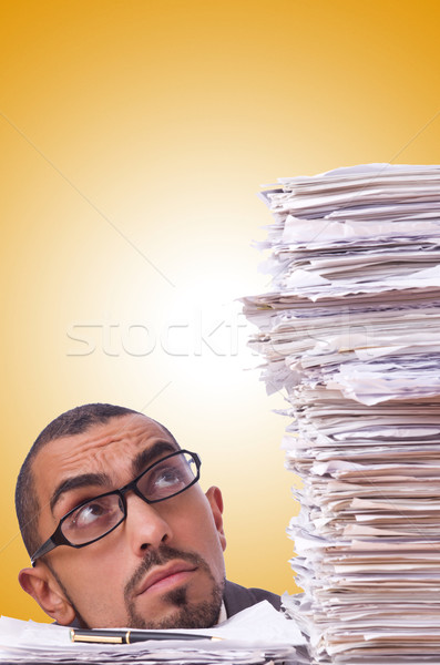 Busy businessman with lots of papers Stock photo © Elnur