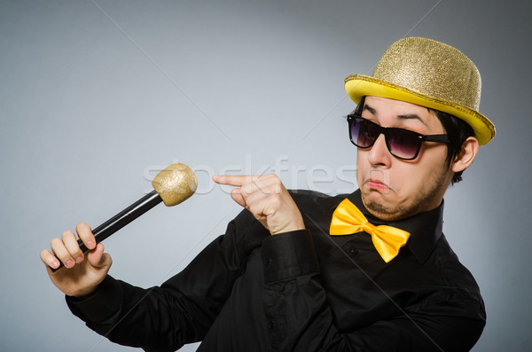 Funny man with mic in karaoke concept Stock photo © Elnur