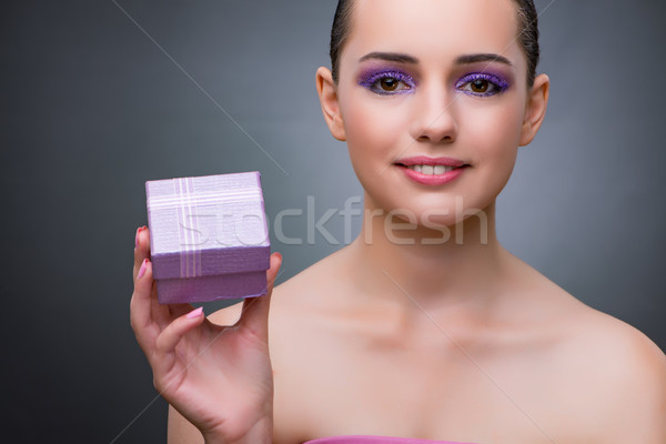 Young woman receiving small giftbox Stock photo © Elnur