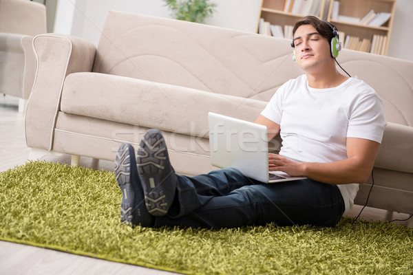 Freelancer working at home and listening to music Stock photo © Elnur