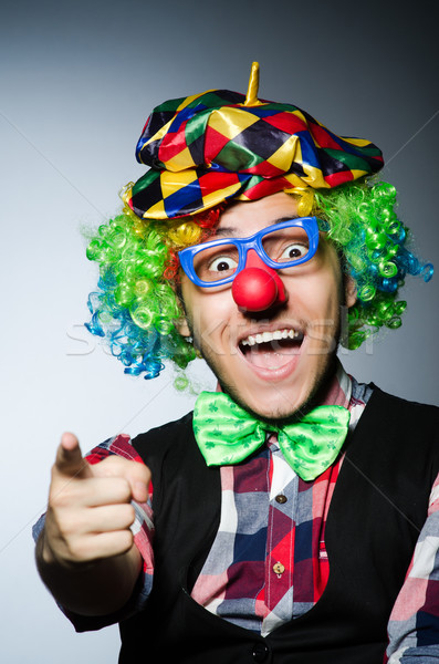 Funny clown against the dark background Stock photo © Elnur