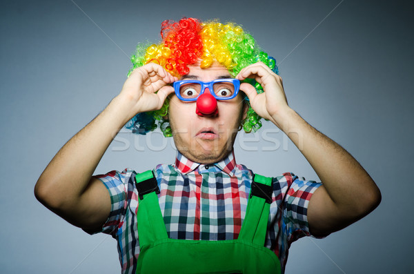 Funny clown against the dark background Stock photo © Elnur