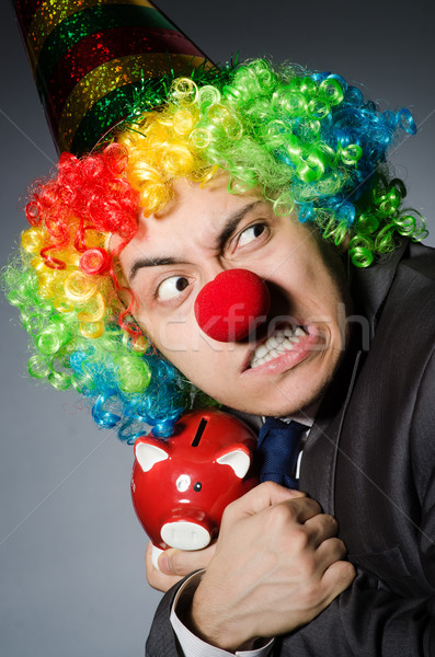 Clown with piggybank in funny concept Stock photo © Elnur