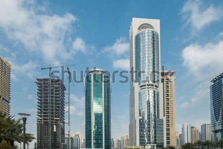 Tall skyscrapers in Dubai near water Stock photo © Elnur