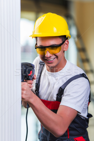 Man drilling the wall with drill perforator Stock photo © Elnur