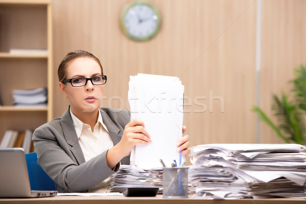 Businesswoman under stress from too much work in the office Stock photo © Elnur