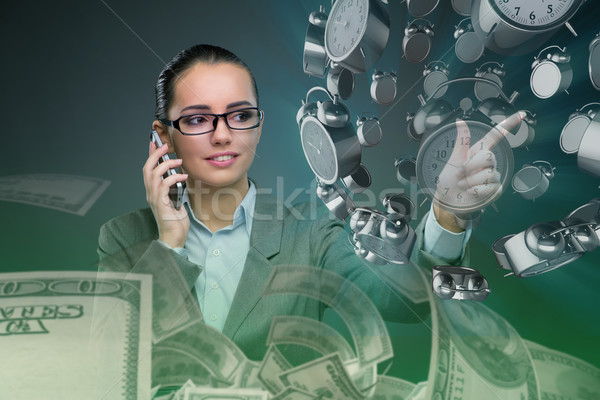 Businesswoman in time management concept Stock photo © Elnur