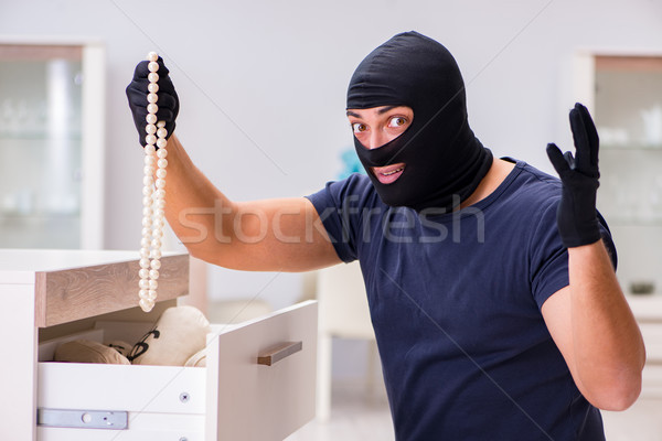 Robber wearing balaclava stealing valuable things Stock photo © Elnur