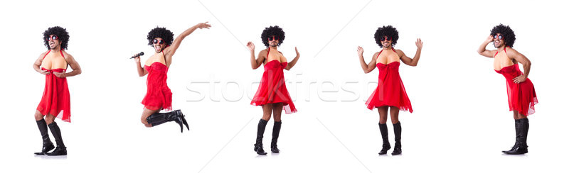 Man in female clothing singing with mic Stock photo © Elnur