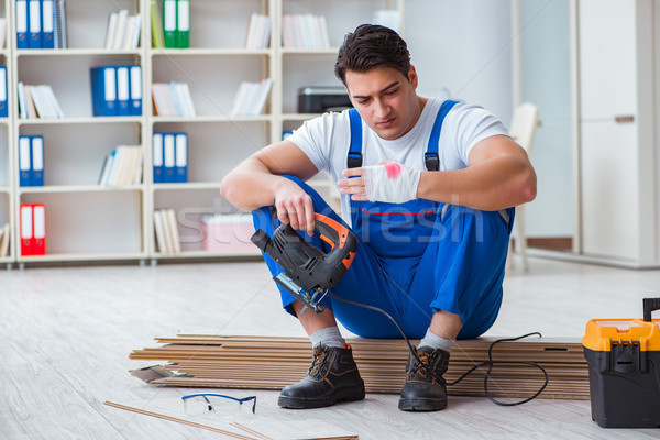 Fiatal munkás dolgozik padló csempék ház Stock fotó © Elnur