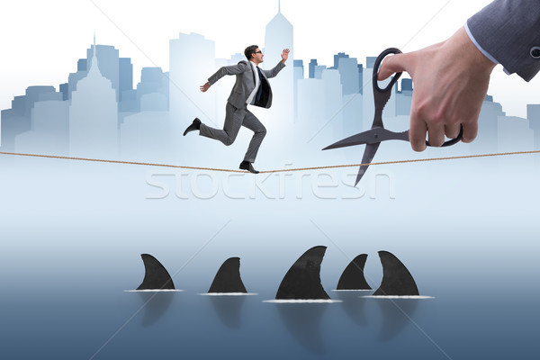Hand cutting rope in business risk concept Stock photo © Elnur