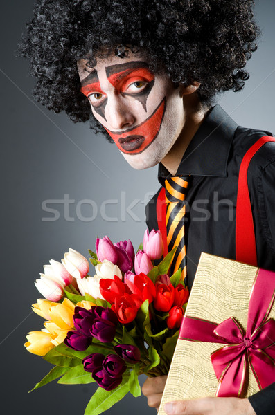 Sad clown with the flowers Stock photo © Elnur