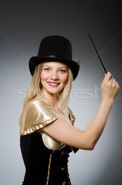 Woman magician with magic wand and hat Stock photo © Elnur