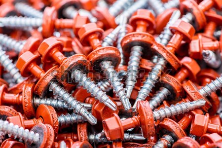 Stock photo: Many screws arranged as background