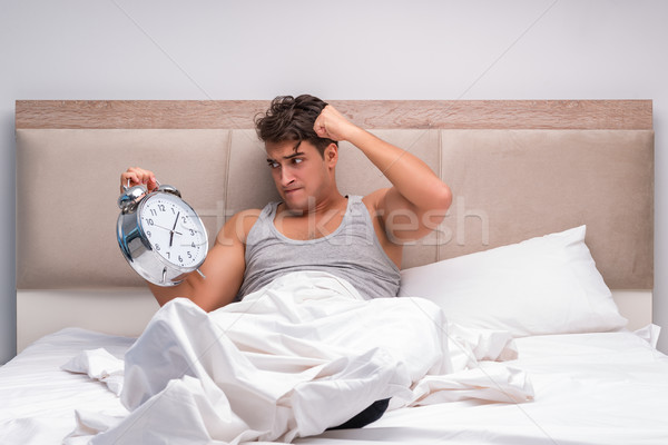 Man having trouble waking up in the morning Stock photo © Elnur