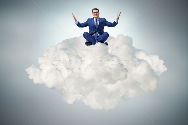 The businessman sitting at top cloud Stock photo © Elnur