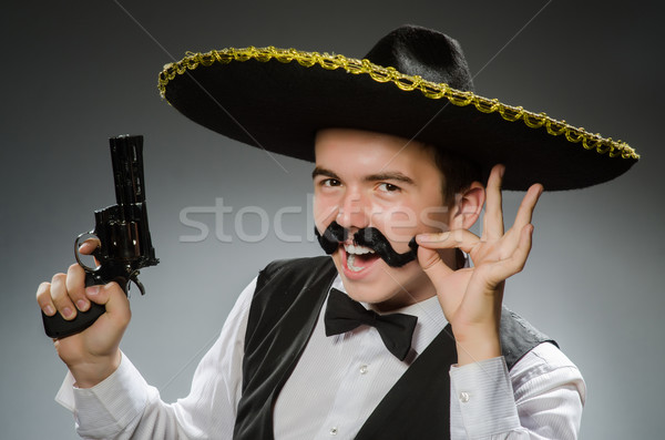 Stock photo: Smiling mexican with sombrero isolated on white