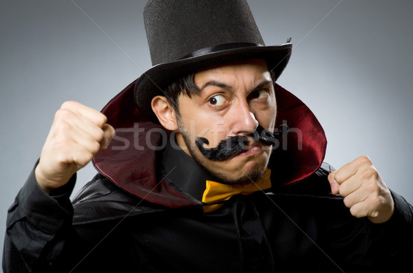 Funny magician man wearing tophat Stock photo © Elnur