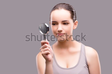 Woman with magnifying glass in sports concept Stock photo © Elnur