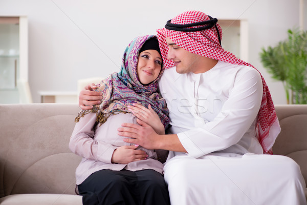 Young arab muslim family with pregnant wife expecting baby Stock photo © Elnur