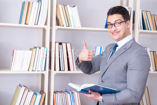 The businessman student reading a book studying in library Stock photo © Elnur