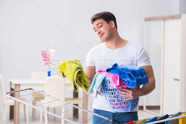 The man doing laundry at home Stock photo © Elnur