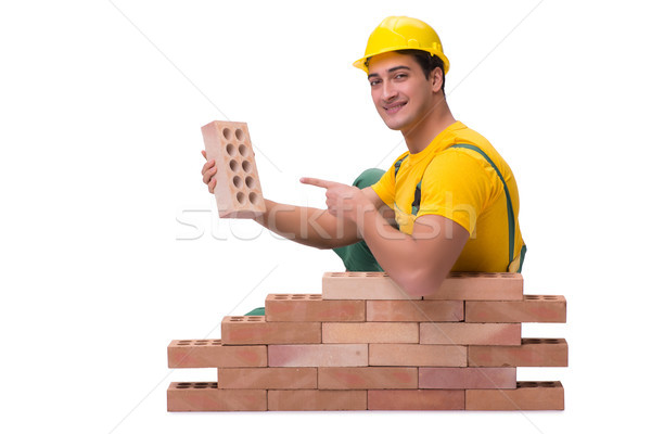 The handsome construction worker building brick wall Stock photo © Elnur