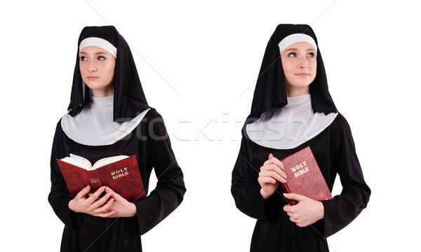 Young nun with bible isolated on white Stock photo © Elnur