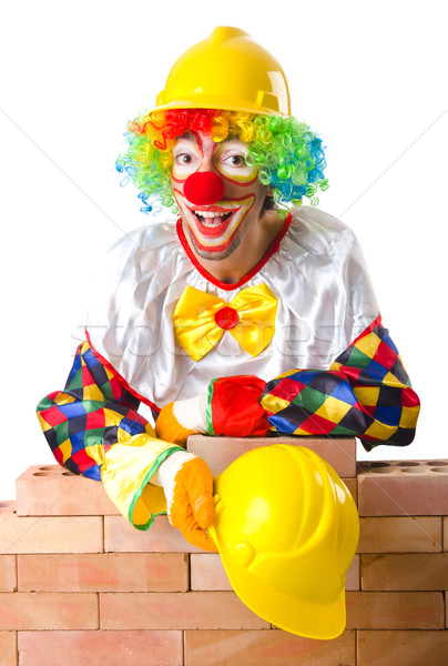 Bad construction concept with clown laying bricks Stock photo © Elnur