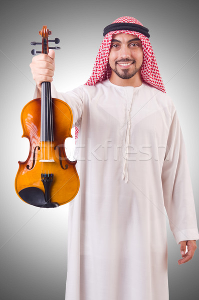 Arab man playing music on white Stock photo © Elnur