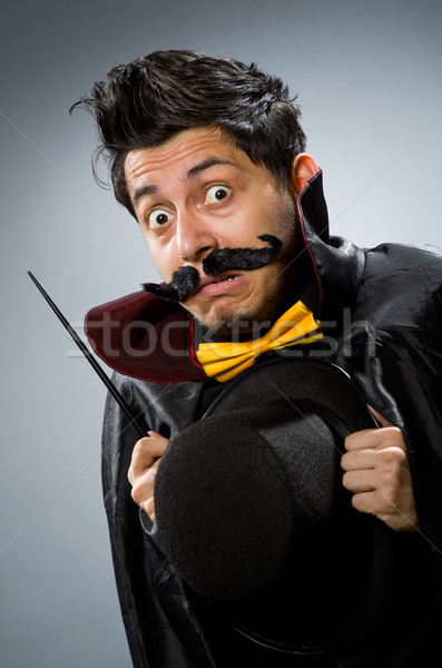 Funny magician man with wand and hat Stock photo © Elnur