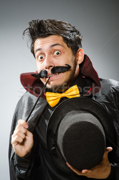 Funny magician man with wand and hat Stock photo © Elnur