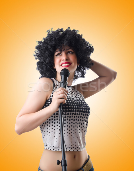 Pop star with mic  on white Stock photo © Elnur