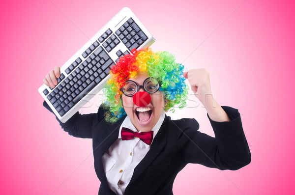 Funny clown with keyboard on white Stock photo © Elnur