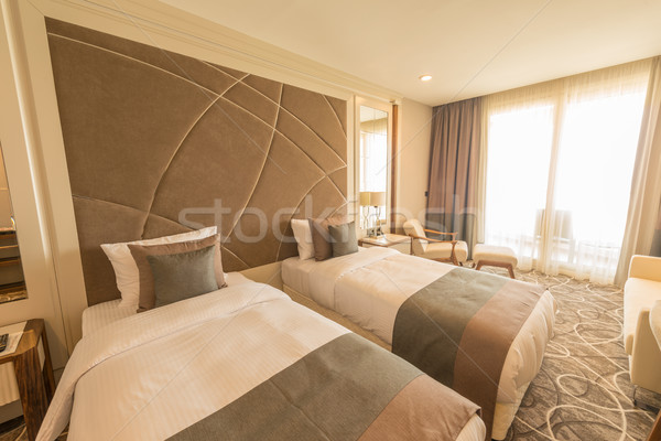 Modern hotel room with big bed Stock photo © Elnur