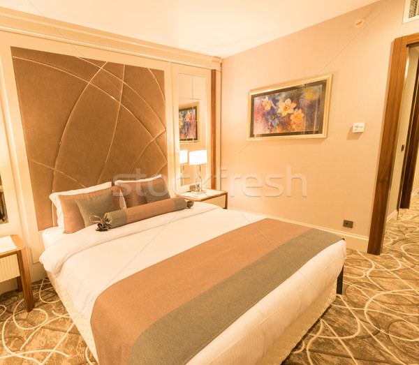 Modern hotel room with big bed Stock photo © Elnur