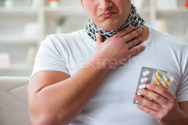 Stock photo: Young man suffering from sore throat