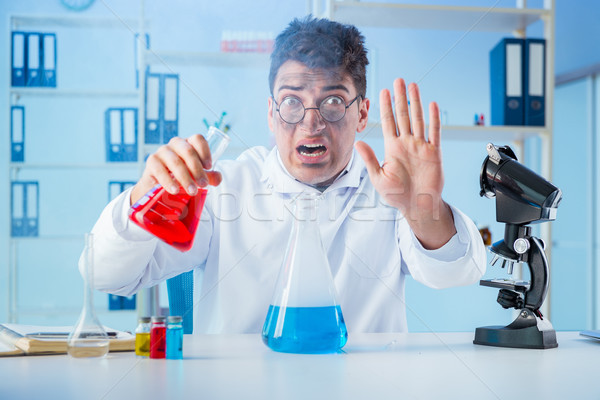 Funny mad chemist working in a laboratory Stock photo © Elnur