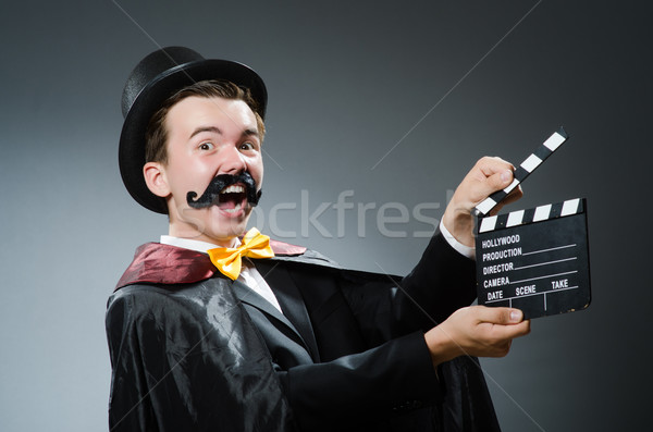 Funny man with movie clapper board Stock photo © Elnur
