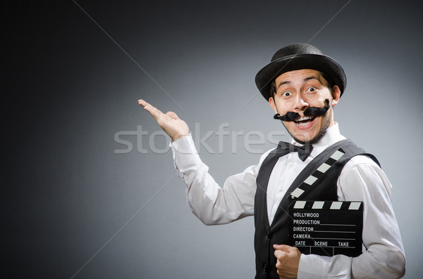 Funny man with movie clapper board  Stock photo © Elnur