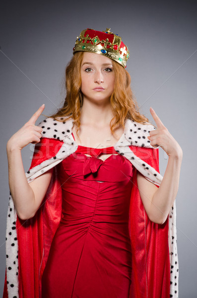 Stock photo: Queen in red dress in studio