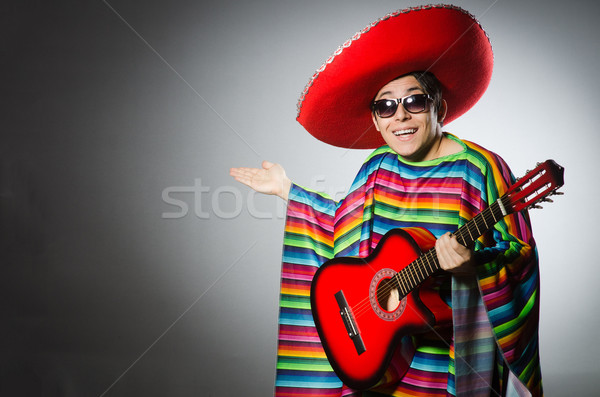 Man in red sombrero playing guitar Stock photo © Elnur