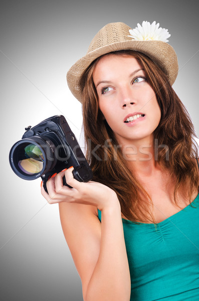 Attractive female photographer on white Stock photo © Elnur