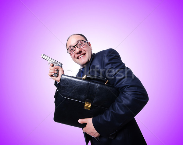 Businessman with gun isolated on white Stock photo © Elnur