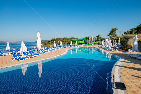 Nice swimming pool outdoors on bright summer day Stock photo © Elnur