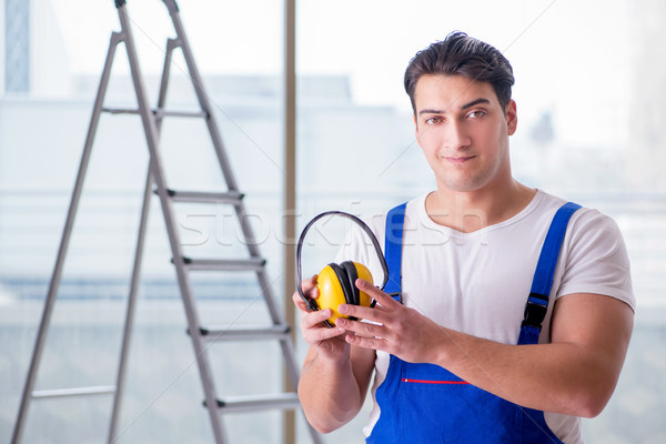 Worker with noise cancelling headphones Stock photo © Elnur