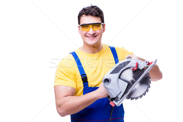 Carpenter wearing coveralls with circular saw isolated on white Stock photo © Elnur