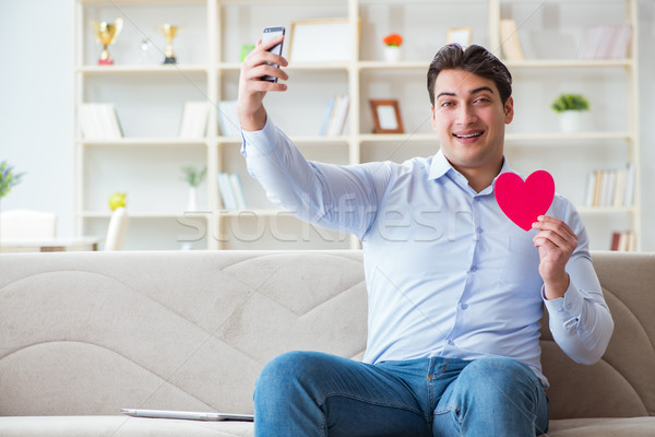 The young man chatting with his sweetheart over mobile phone Stock photo © Elnur