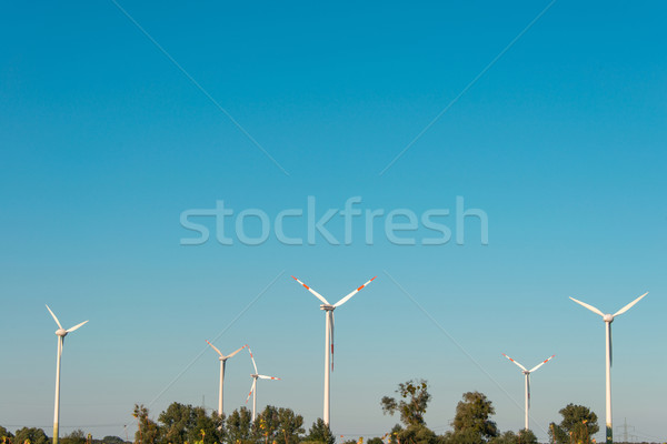 Stock photo: Wind mills during bright summer day