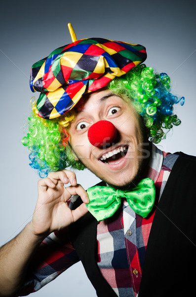 Funny clown against the dark background Stock photo © Elnur